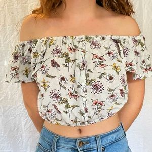 Off-the shoulder creams / white floral crop top with faux buttons
